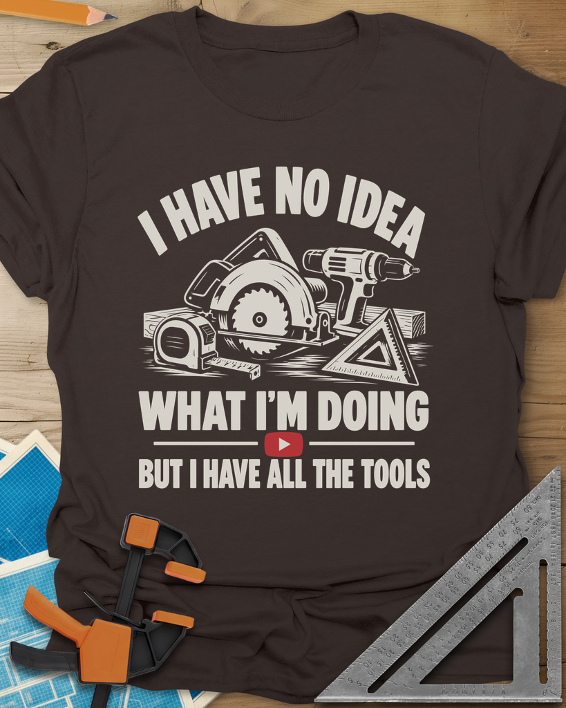 All The Tools t-shirt in Dark Chocolate, circular saw, drill, tape measure and square above a play button