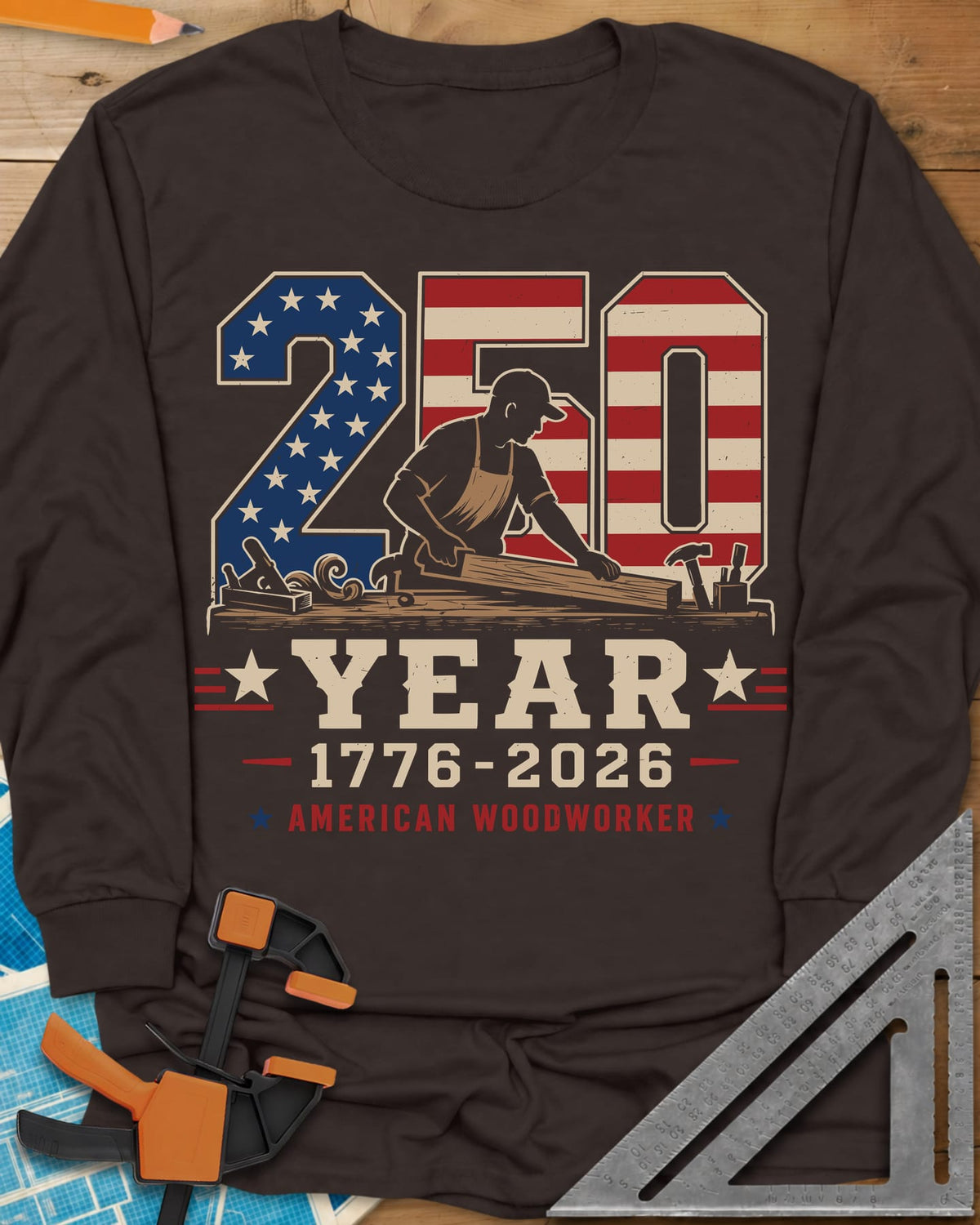 250 Year American Woodworker long sleeve shirt in Dark Chocolate, stars-and-stripes 250 with a woodworker planing a board