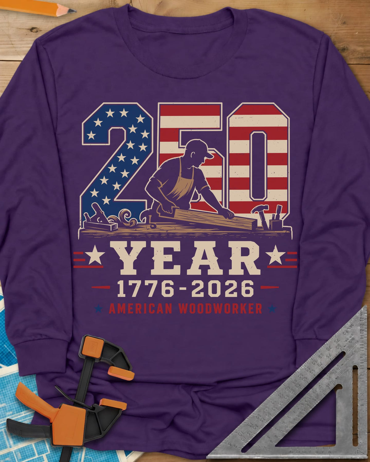 250 Year American Woodworker long sleeve shirt in Purple, stars-and-stripes 250 with a woodworker planing a board