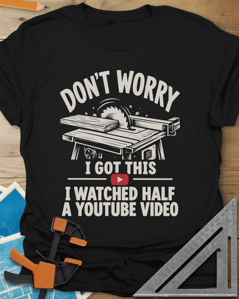 YouTube Video t-shirt in Black, a table saw with a board at the blade above a red play button