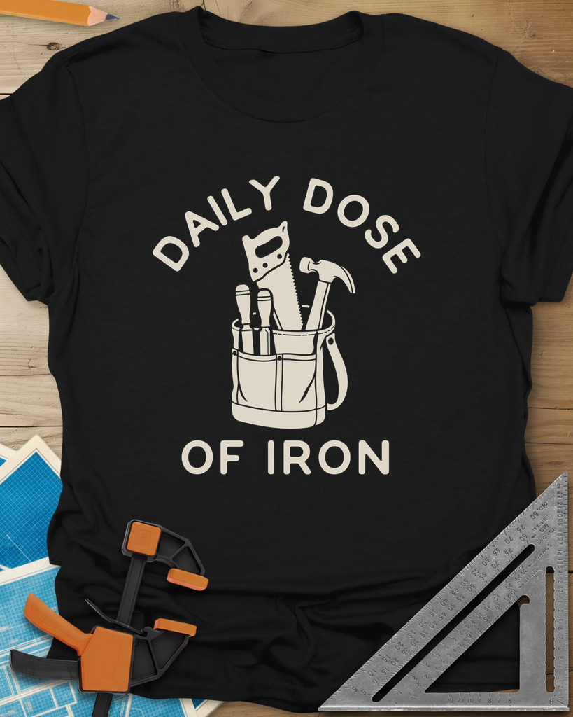 Daily Dose t-shirt in Black, a canvas tool bag holding a handsaw, hammer and two chisels