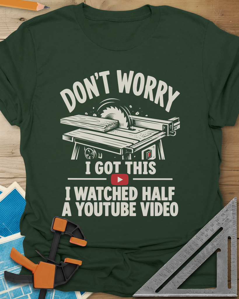 YouTube Video t-shirt in Forest Green, a table saw with a board at the blade above a red play button