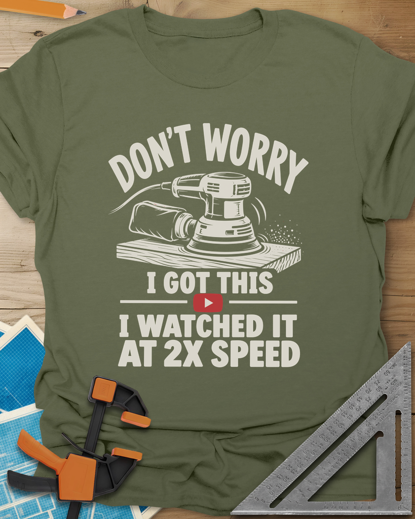 2x Speed t-shirt in Military Green, an orbital sander on a board beside a red video play button
