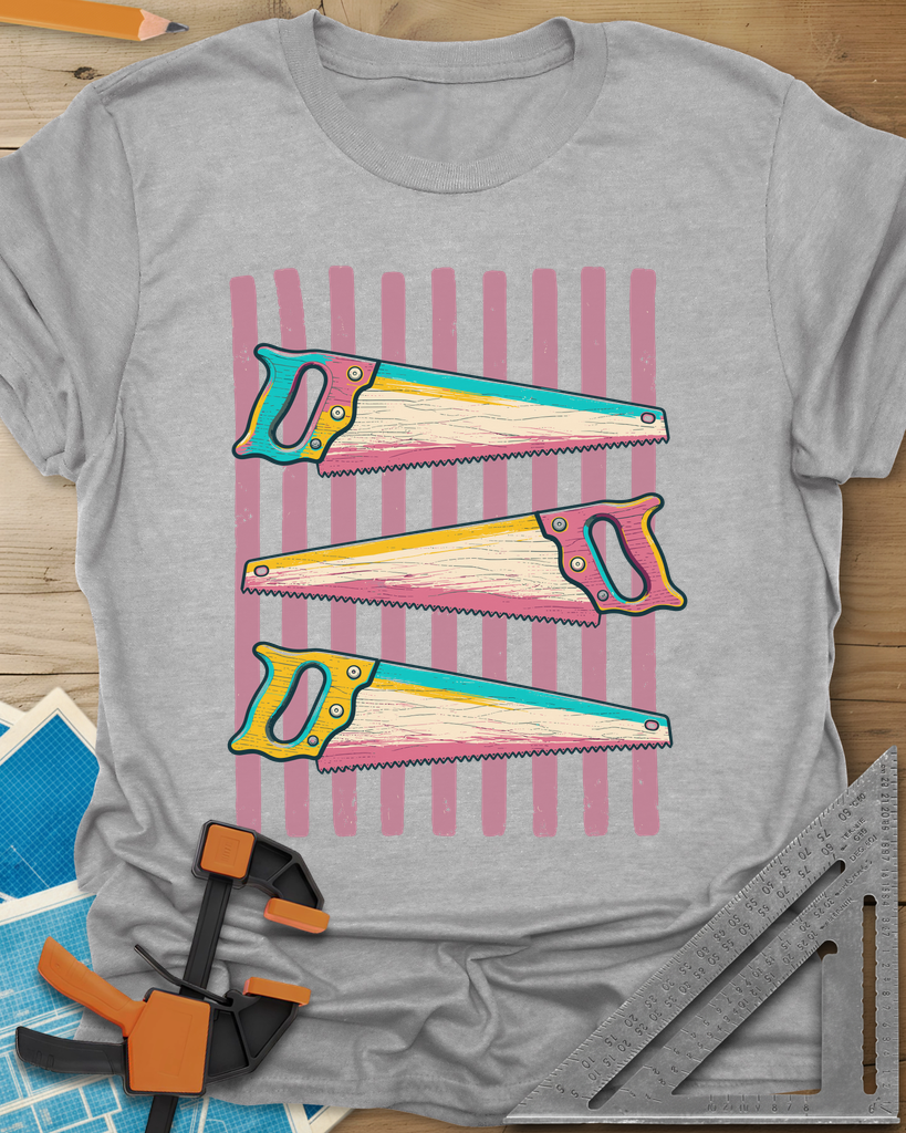 Colorful Saws t-shirt in Sport Grey, three hand saws in teal, yellow and pink over pink stripes