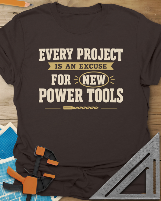 Every Project Is An Excuse t-shirt in Dark Chocolate, slogan with a ribbon banner, circled NEW and a drill bit