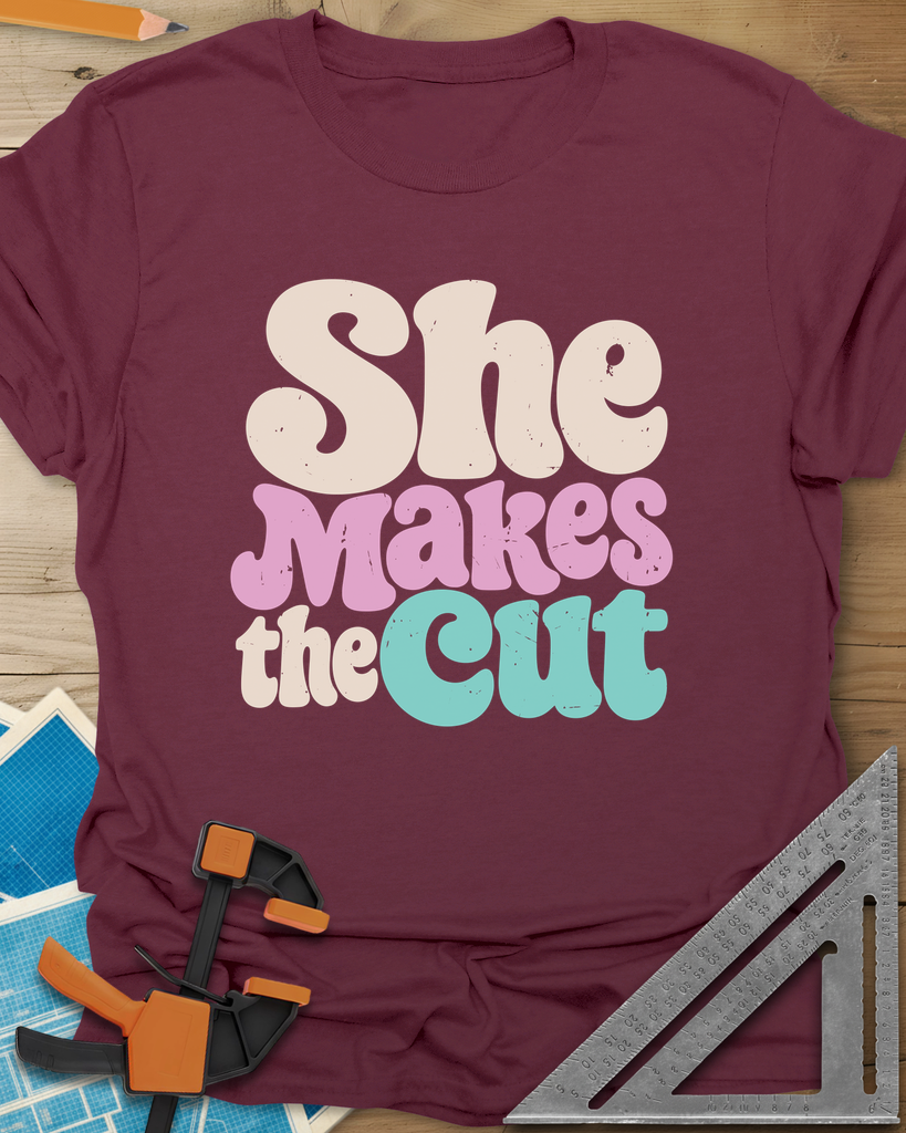 She Makes The Cut Tee — maroon