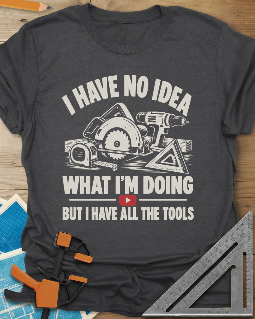 All The Tools t-shirt in Dark Heather Grey, circular saw, drill, tape measure and square above a play button