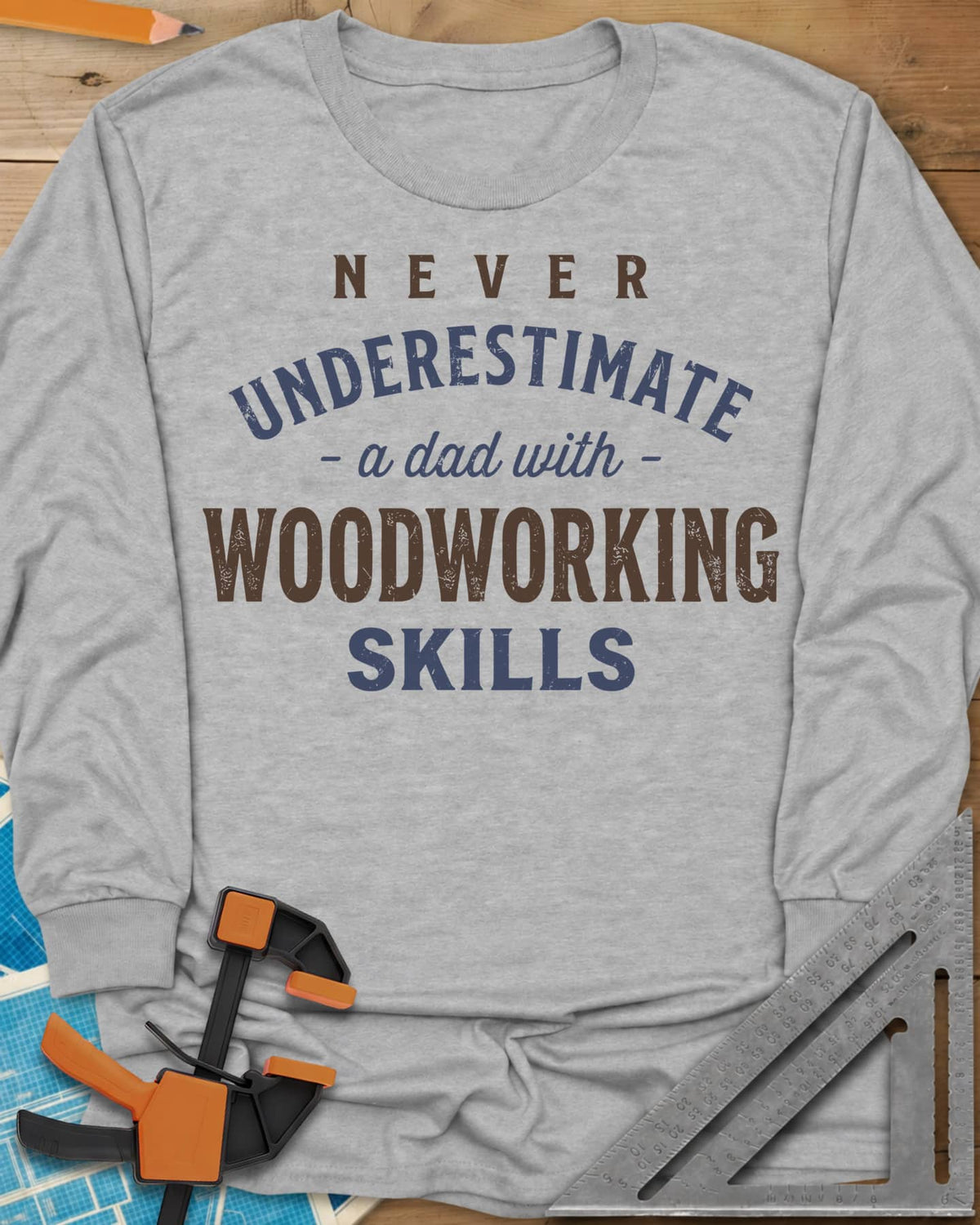 A Dad With Woodworking Skills long sleeve shirt in Sport Grey, arched worn lettering with WOODWORKING in the biggest letters