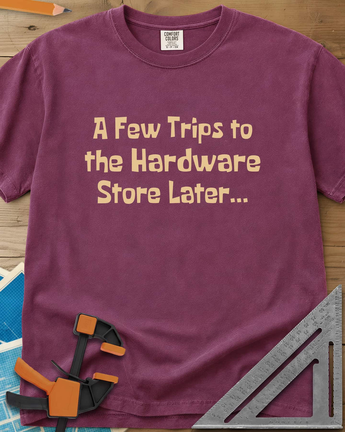 A Few Trips To The Hardware Store Later heavyweight tee in Berry, plain lettering in a chunky cartoon typeface
