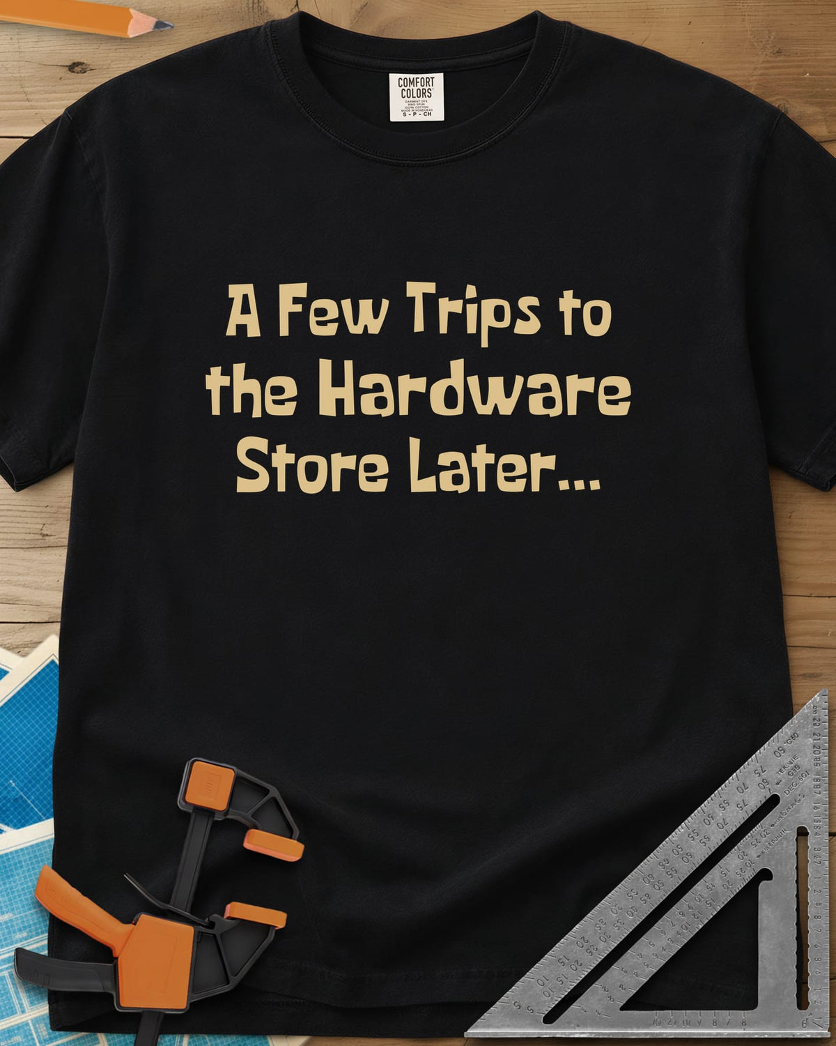 A Few Trips To The Hardware Store Later heavyweight tee in Black, plain lettering in a chunky cartoon typeface