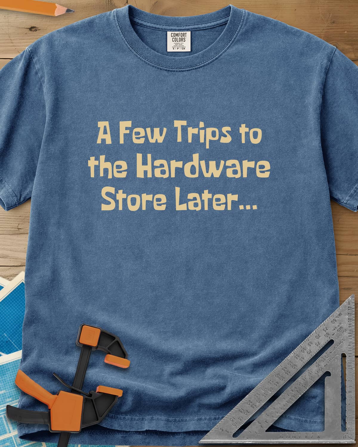 A Few Trips To The Hardware Store Later heavyweight tee in Blue Jean, plain lettering in a chunky cartoon typeface