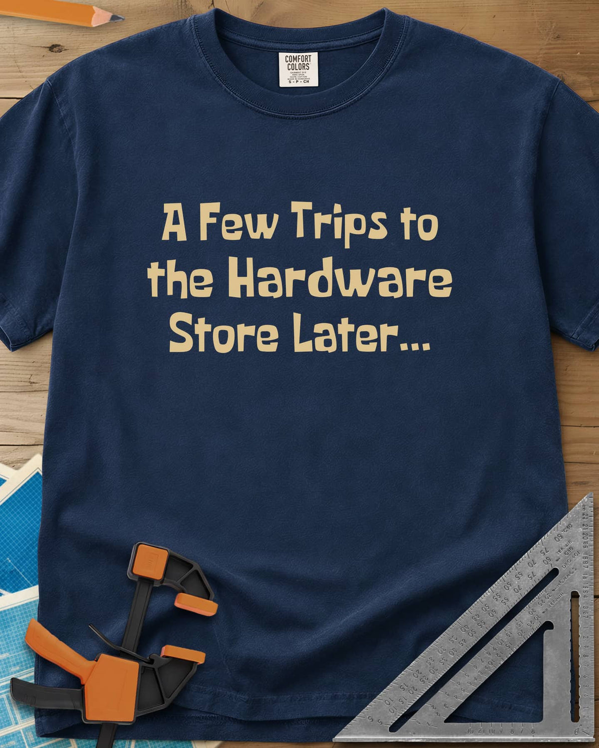 A Few Trips To The Hardware Store Later heavyweight tee in Navy, plain lettering in a chunky cartoon typeface