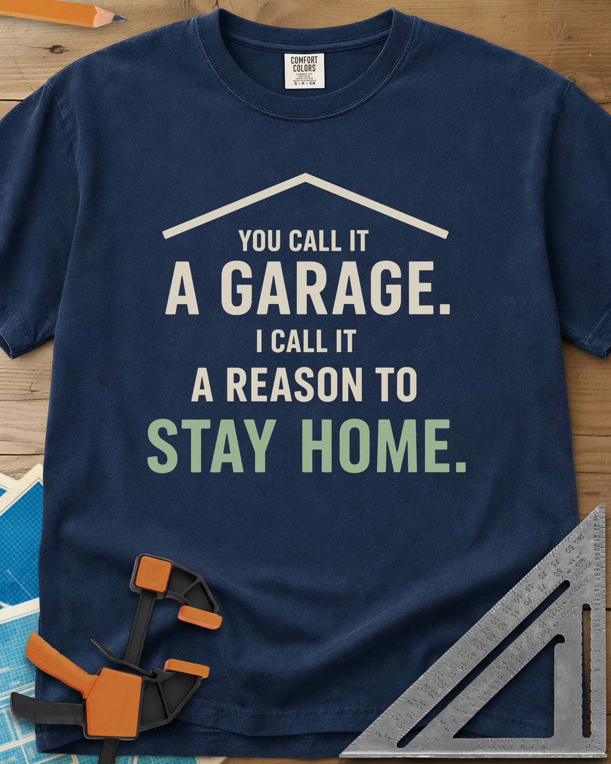 A Reason To Stay Home heavyweight tee in Navy, a simple roofline above bold two-tone lettering