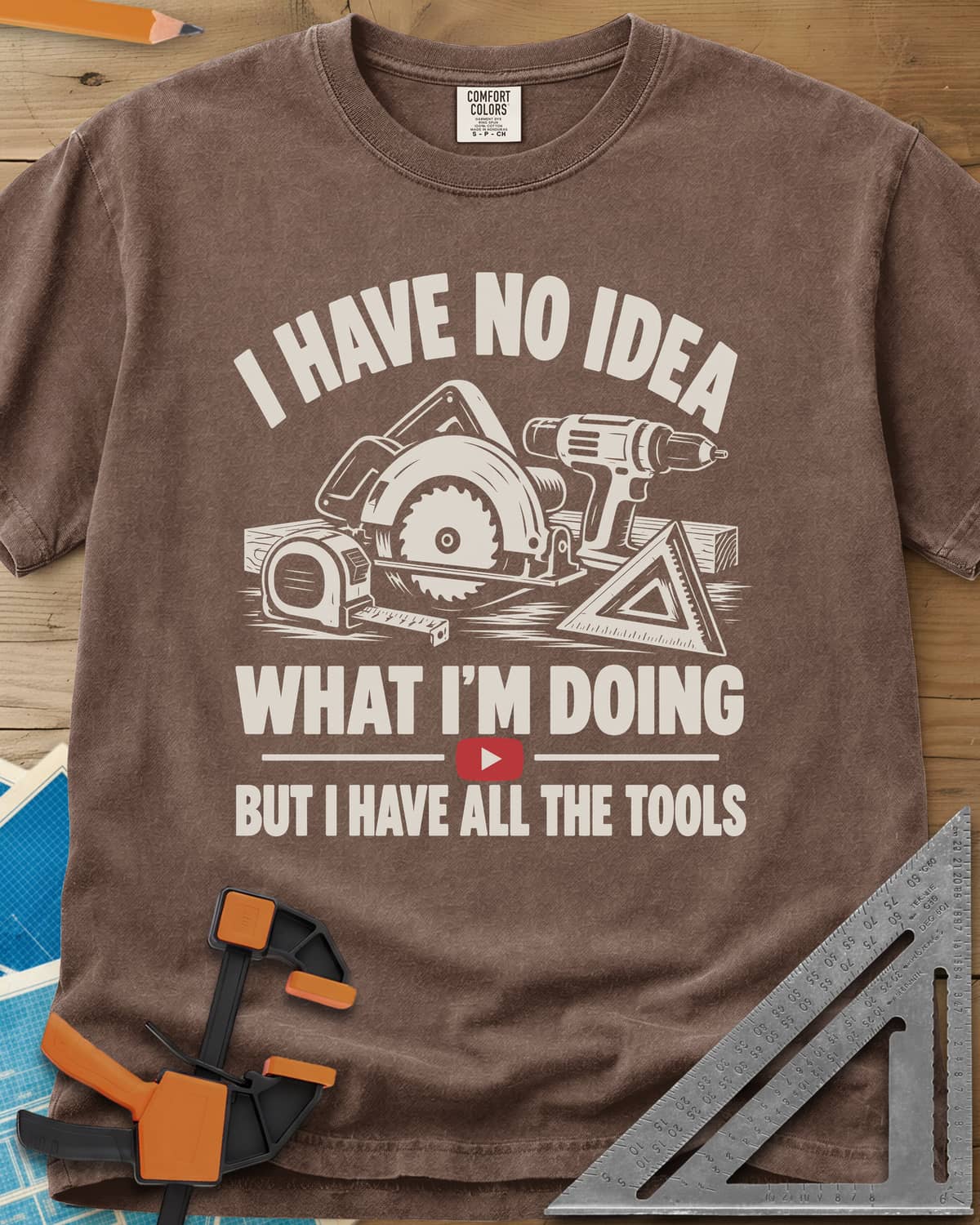 All The Tools heavyweight tee in Espresso, circular saw, drill, tape measure and square above a play button