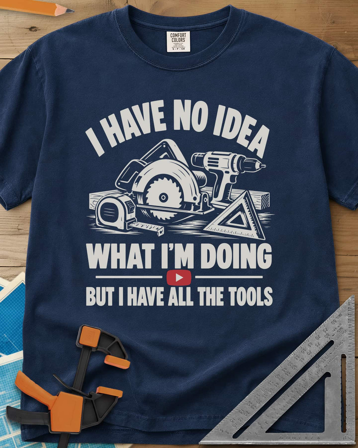 All The Tools heavyweight tee in Navy, circular saw, drill, tape measure and square above a play button