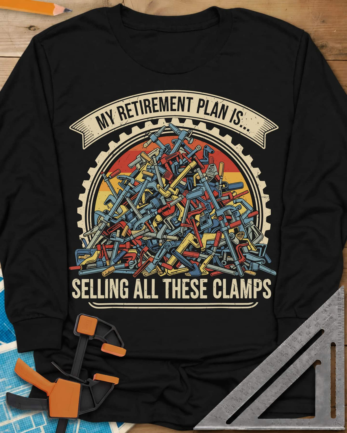 All These Clamps long sleeve shirt in Black, a heap of colorful clamps in a cog ring with a retro sun