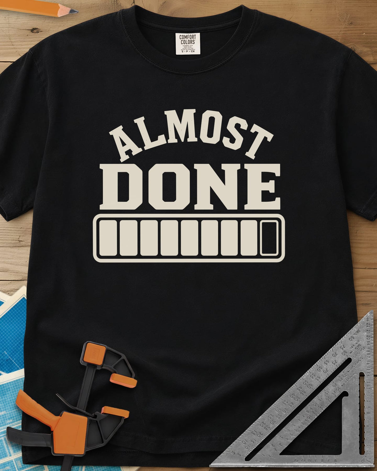 Almost Done heavyweight tee in Black, bold ALMOST DONE lettering over a nearly full loading bar