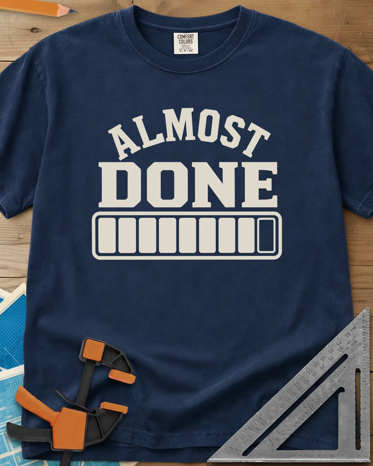 Almost Done heavyweight tee in Navy, bold ALMOST DONE lettering over a nearly full loading bar