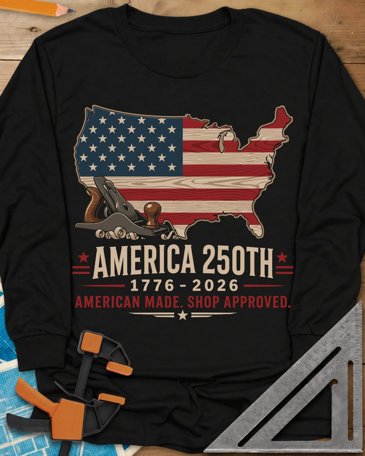 America 250th Shop Approved long sleeve shirt in Black, a US map filled with a wood-plank flag, a hand plane and curls