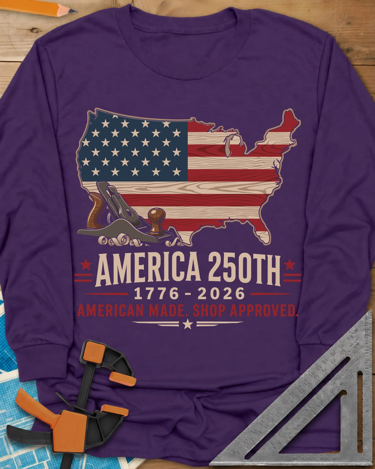 America 250th Shop Approved long sleeve shirt in Purple, a US map filled with a wood-plank flag, a hand plane and curls
