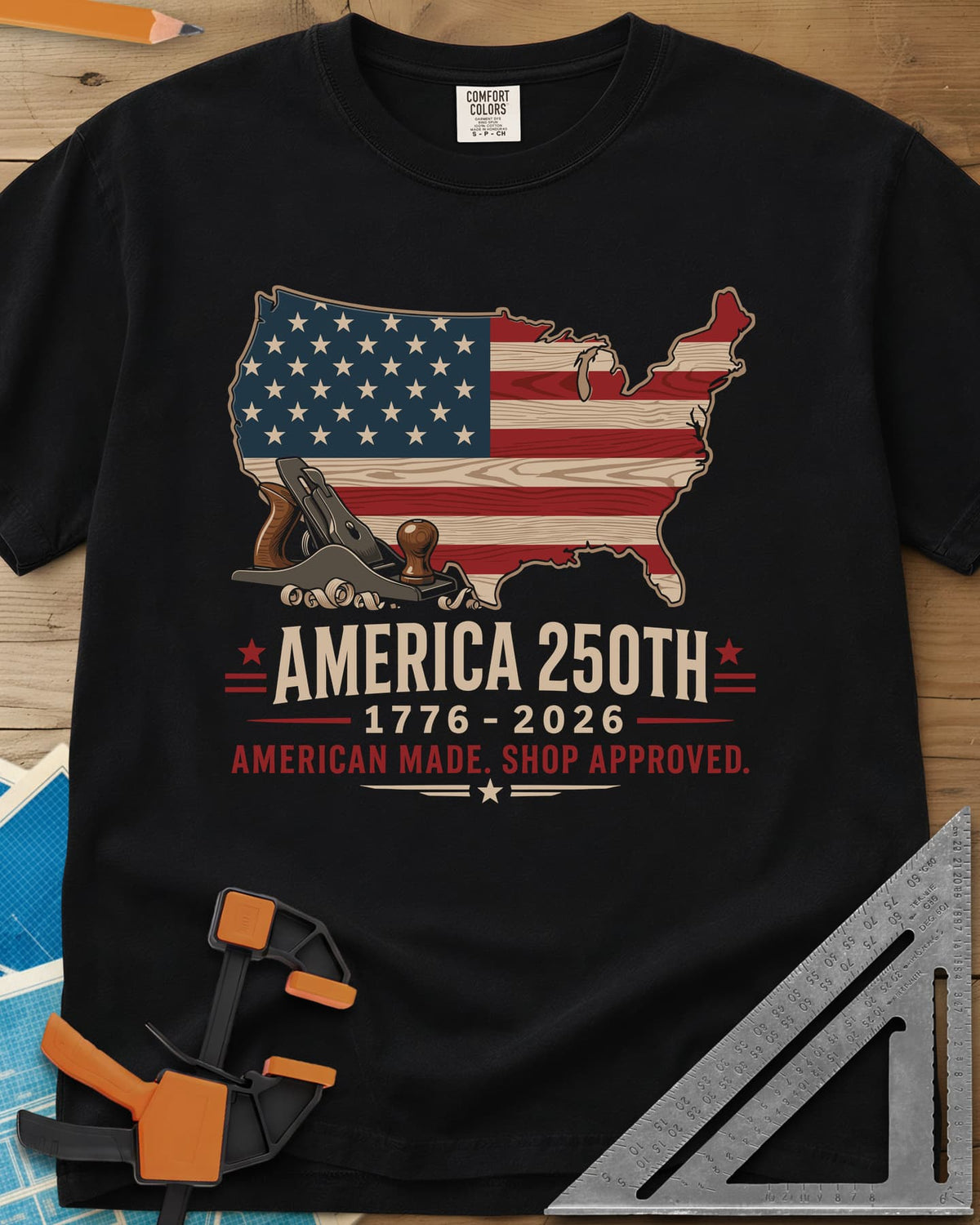 America 250th Shop Approved heavyweight tee in Black, a US map filled with a wood-plank flag, a hand plane and curls