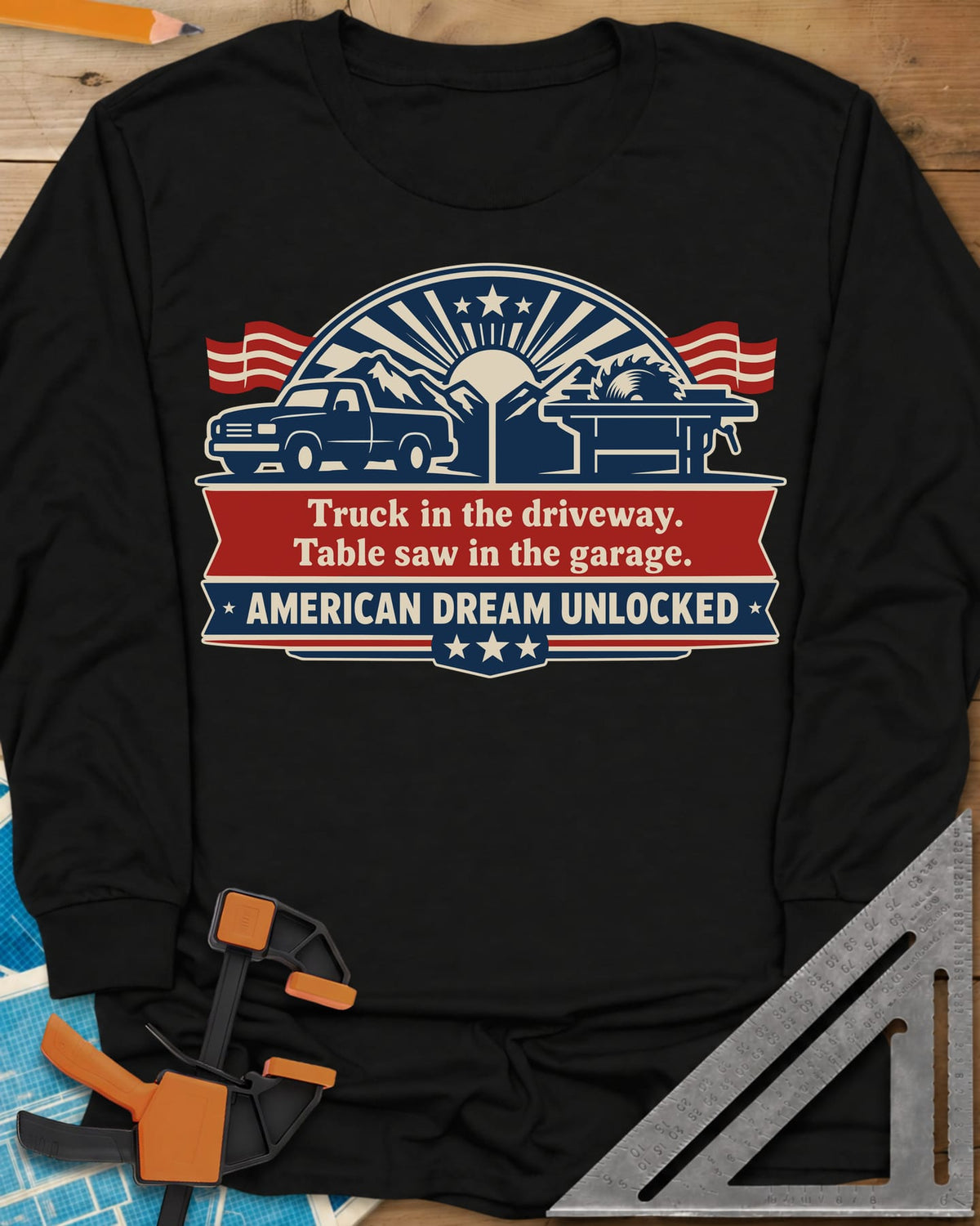 American Dream Unlocked long sleeve shirt in Black, a pickup and a table saw on a red and navy ribbon badge