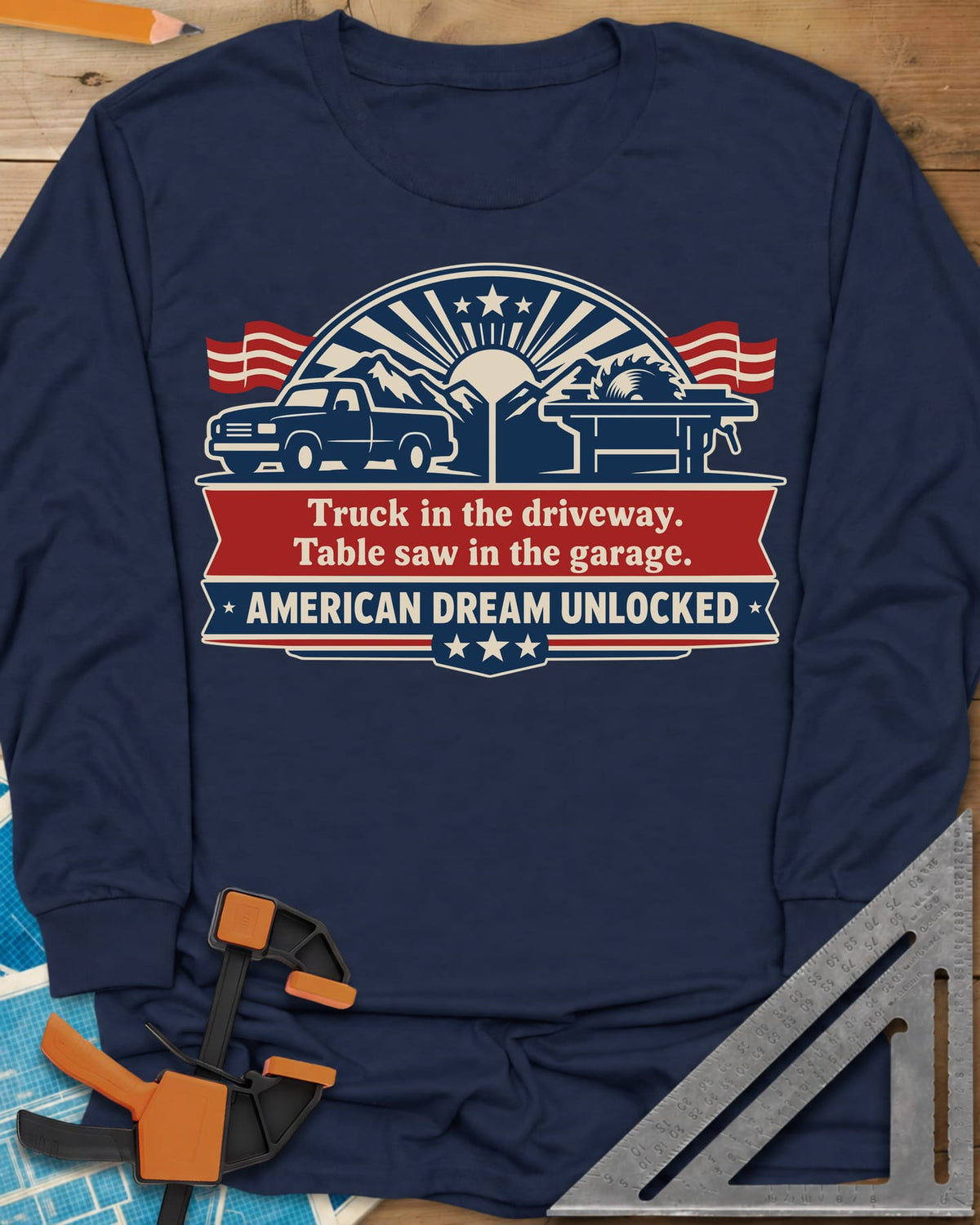 American Dream Unlocked long sleeve shirt in Navy, a pickup and a table saw on a red and navy ribbon badge