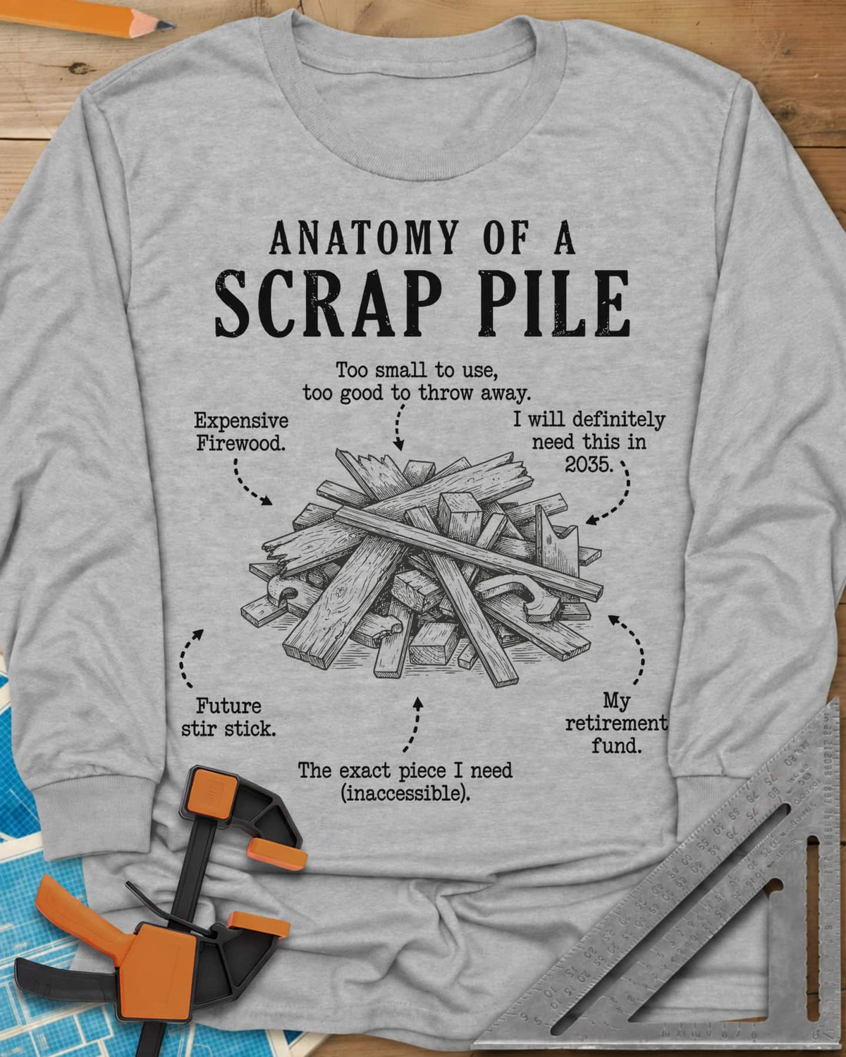 Anatomy of a Scrap Pile long sleeve shirt in Sport Grey, a labeled heap of wood offcuts with dotted-arrow jokes