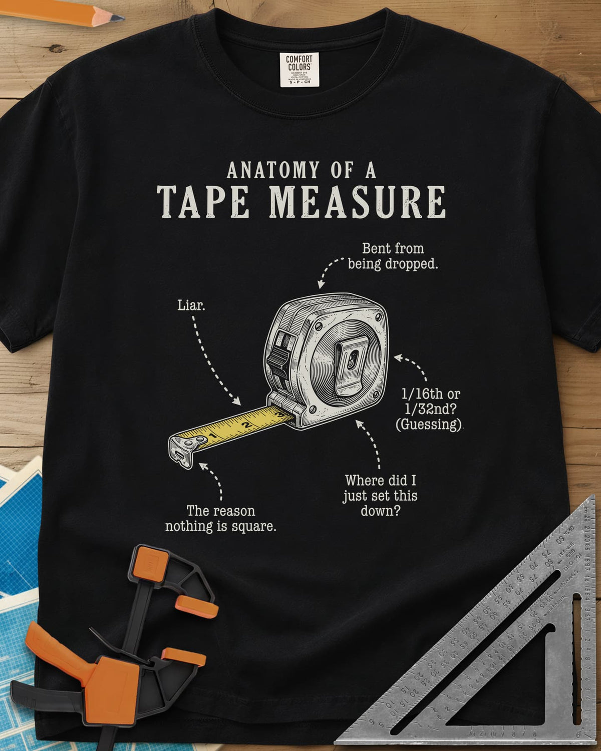 Anatomy of a Tape Measure heavyweight tee in Black, a tape measure diagram with joke labels on dotted arrows