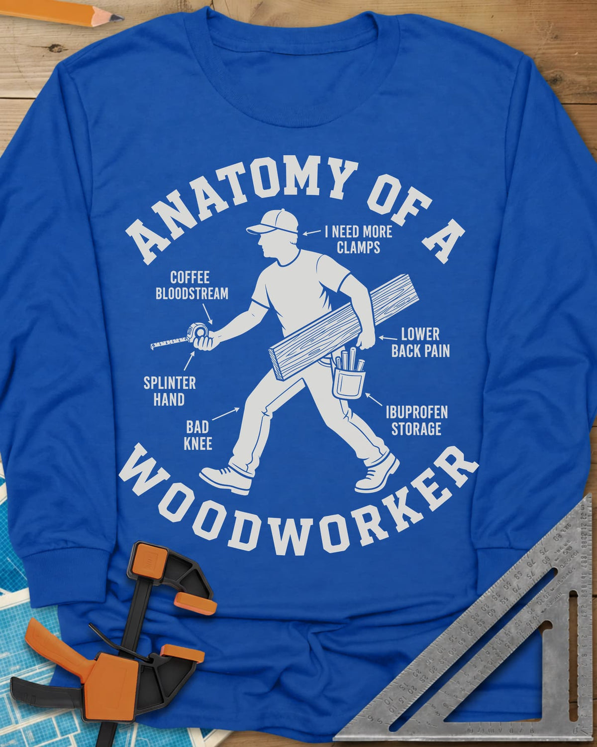 Anatomy Of A Woodworker long sleeve shirt in Royal, a walking man with a board and a tape measure, body parts labeled