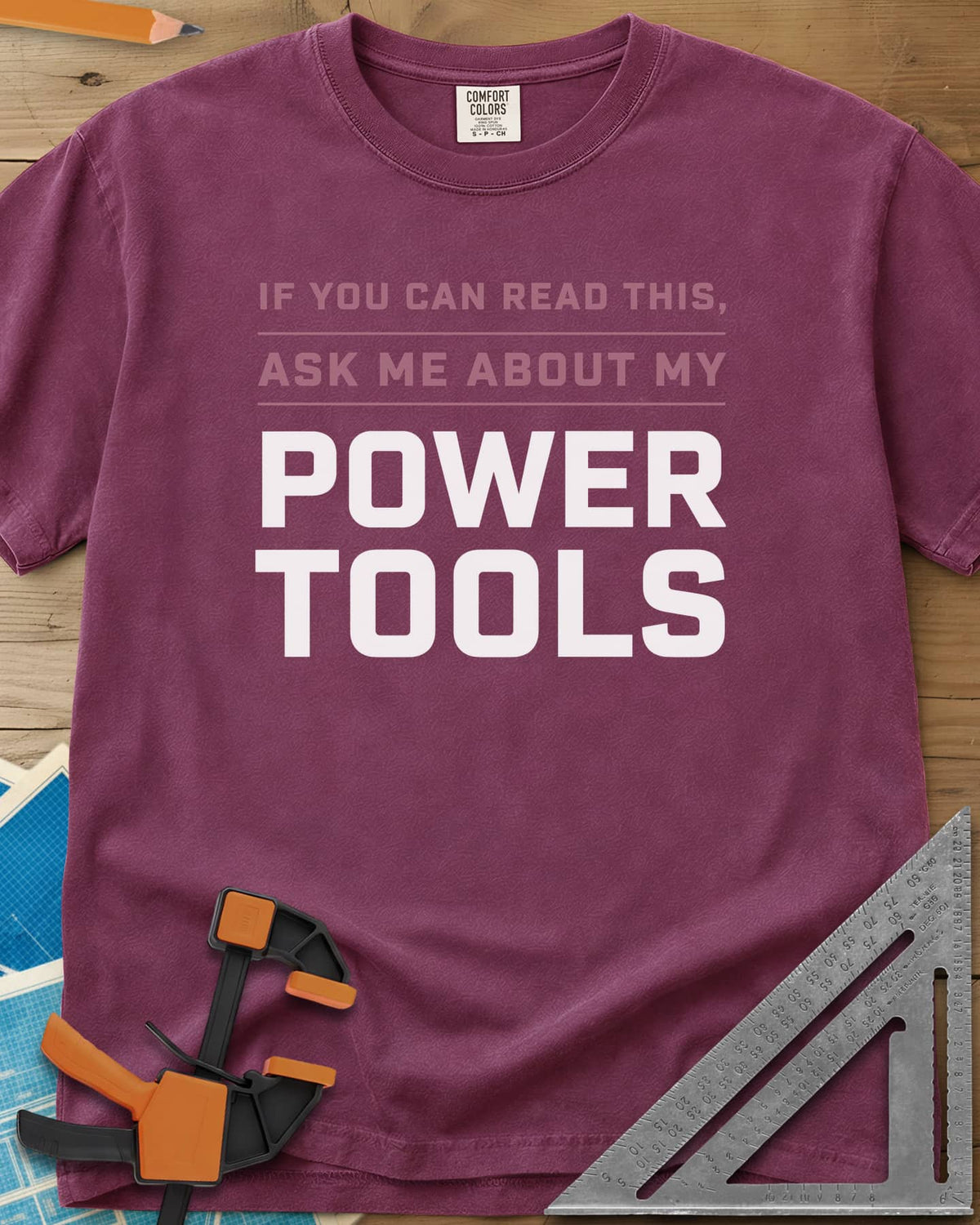 Ask Me About My Power Tools heavyweight tee in Berry, bold block type only, with POWER TOOLS in large letters
