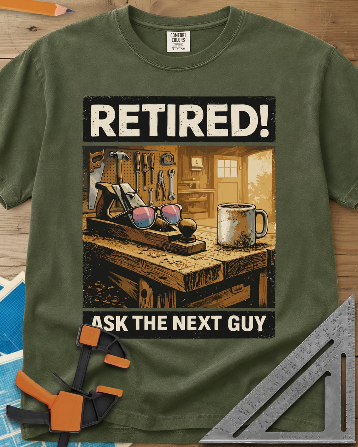 Ask The Next Guy heavyweight tee in Hemp, a sunlit workbench with a hand plane, sunglasses and a coffee mug