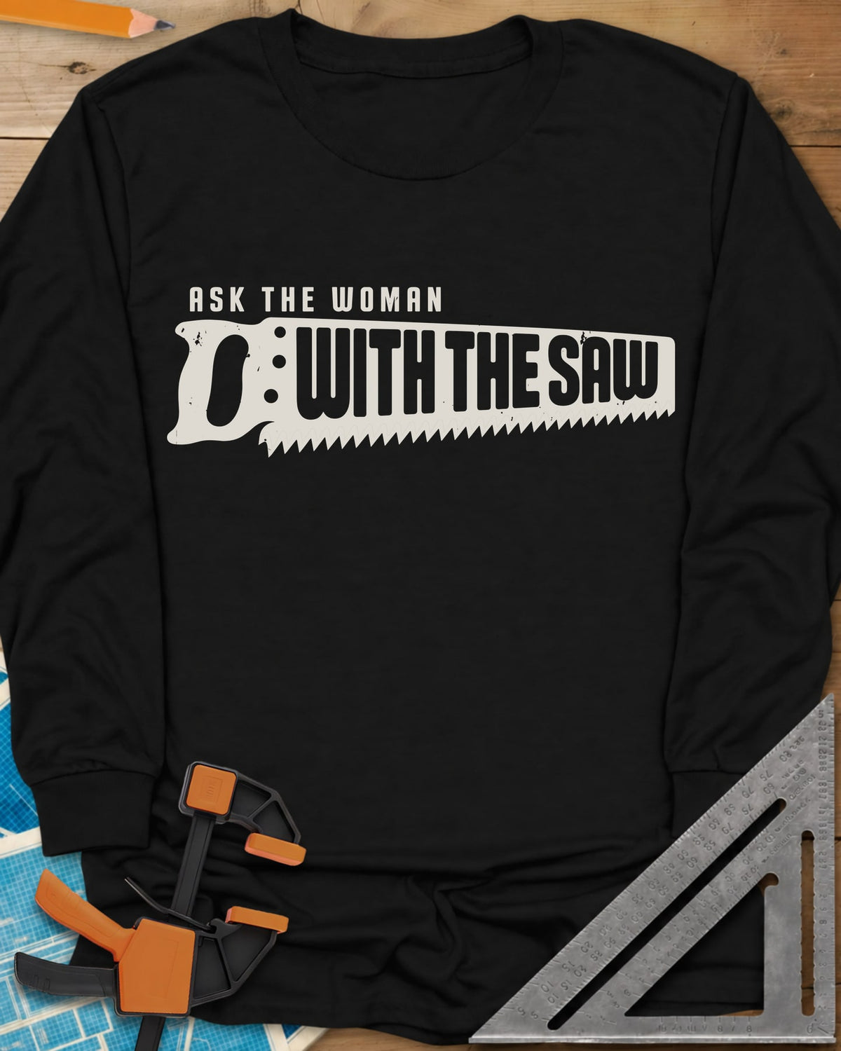 Ask The Saw long sleeve shirt in Black, worn lettering inside a handsaw-shaped banner
