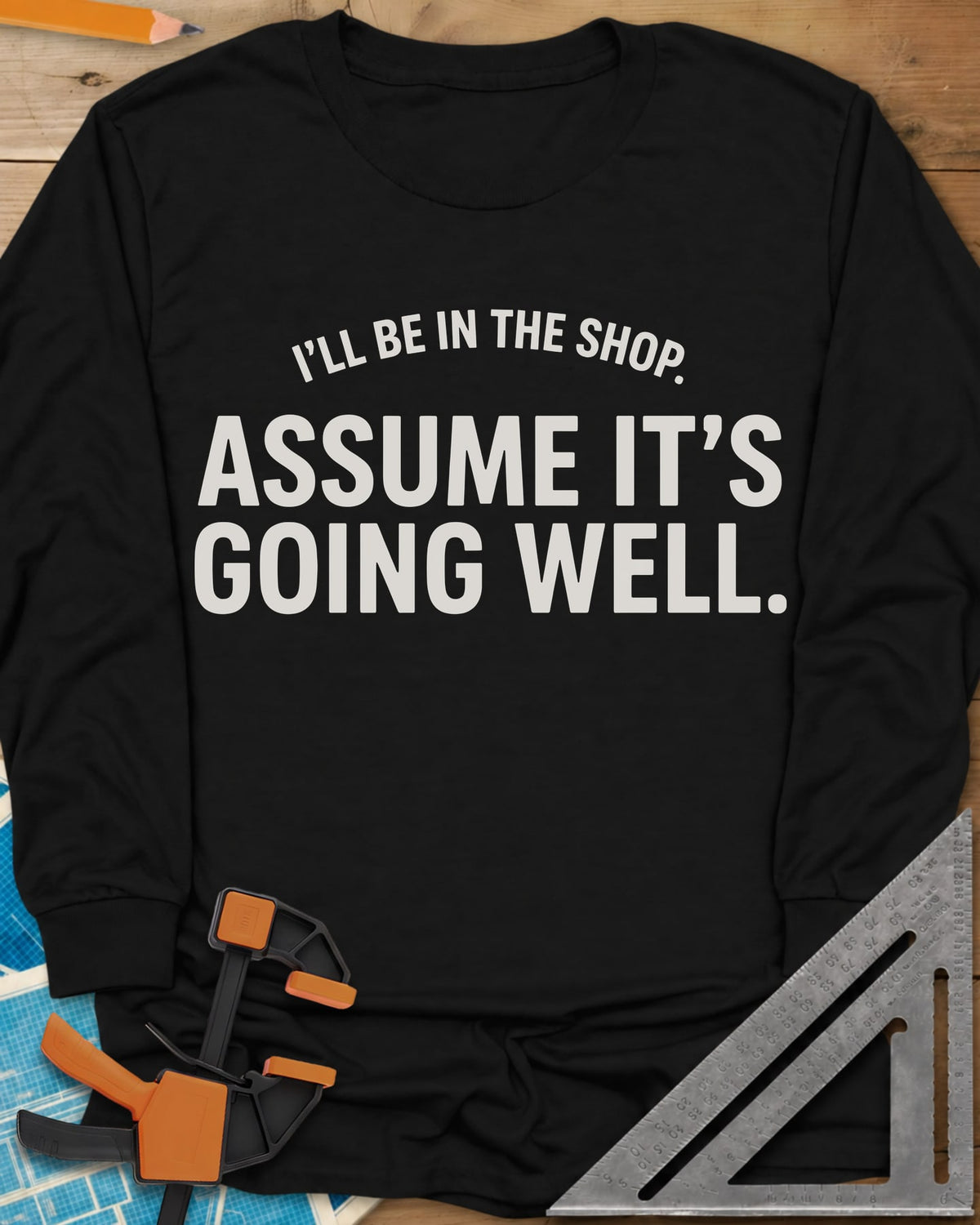 Assume It's Going Well long sleeve shirt in Black, bold two-line lettering with a small arched line above