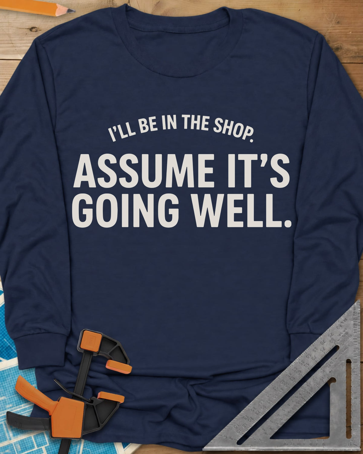 Assume It's Going Well long sleeve shirt in Navy, bold two-line lettering with a small arched line above