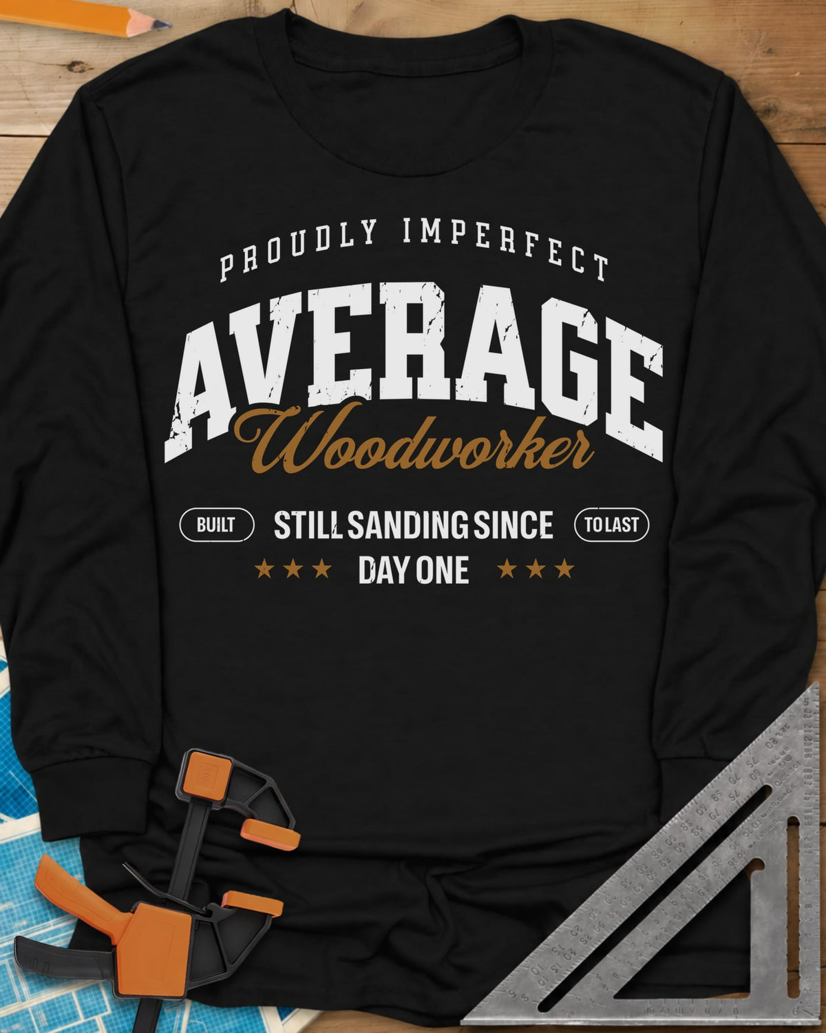 Average Woodworker long sleeve shirt in Black, varsity AVERAGE over gold script Woodworker, with badges and stars