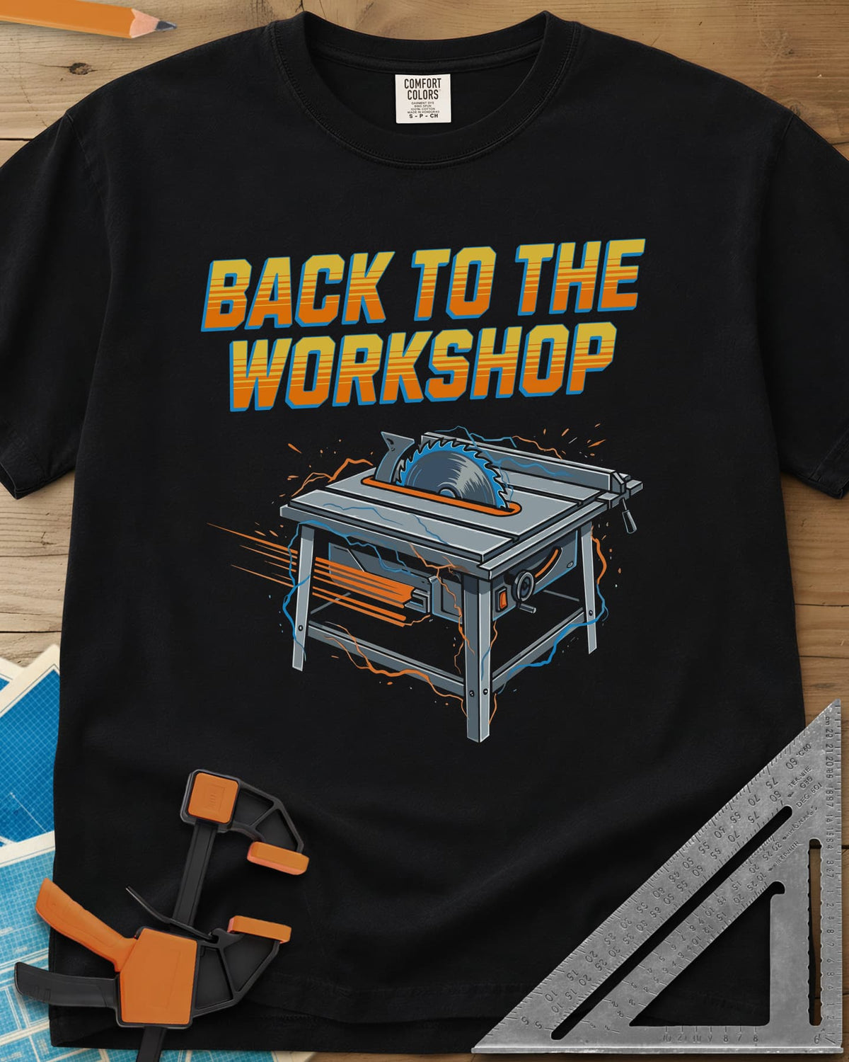 Back To The Workshop heavyweight tee in Black, a table saw crackling with blue electricity and speed streaks