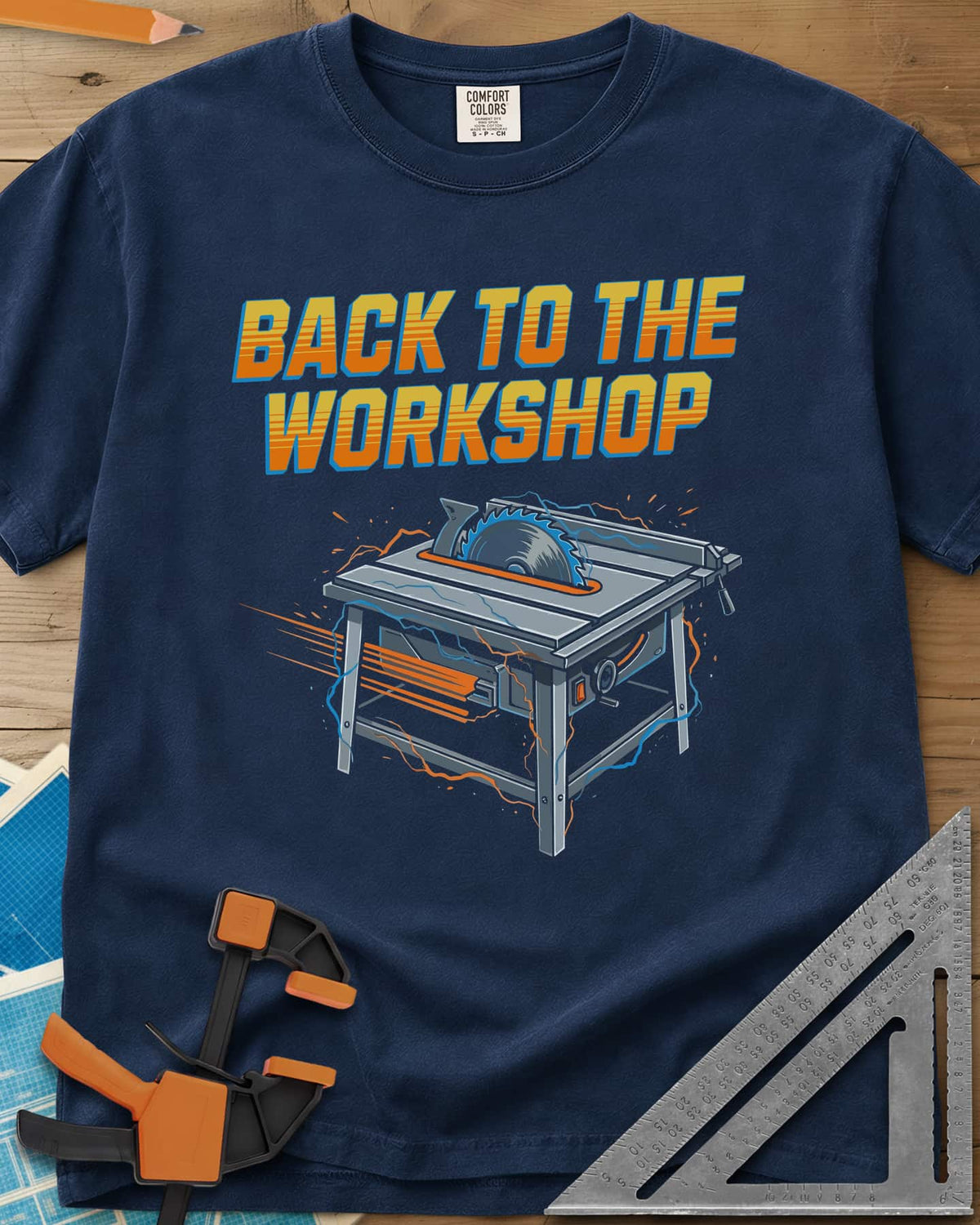 Back To The Workshop heavyweight tee in Navy, a table saw crackling with blue electricity and speed streaks