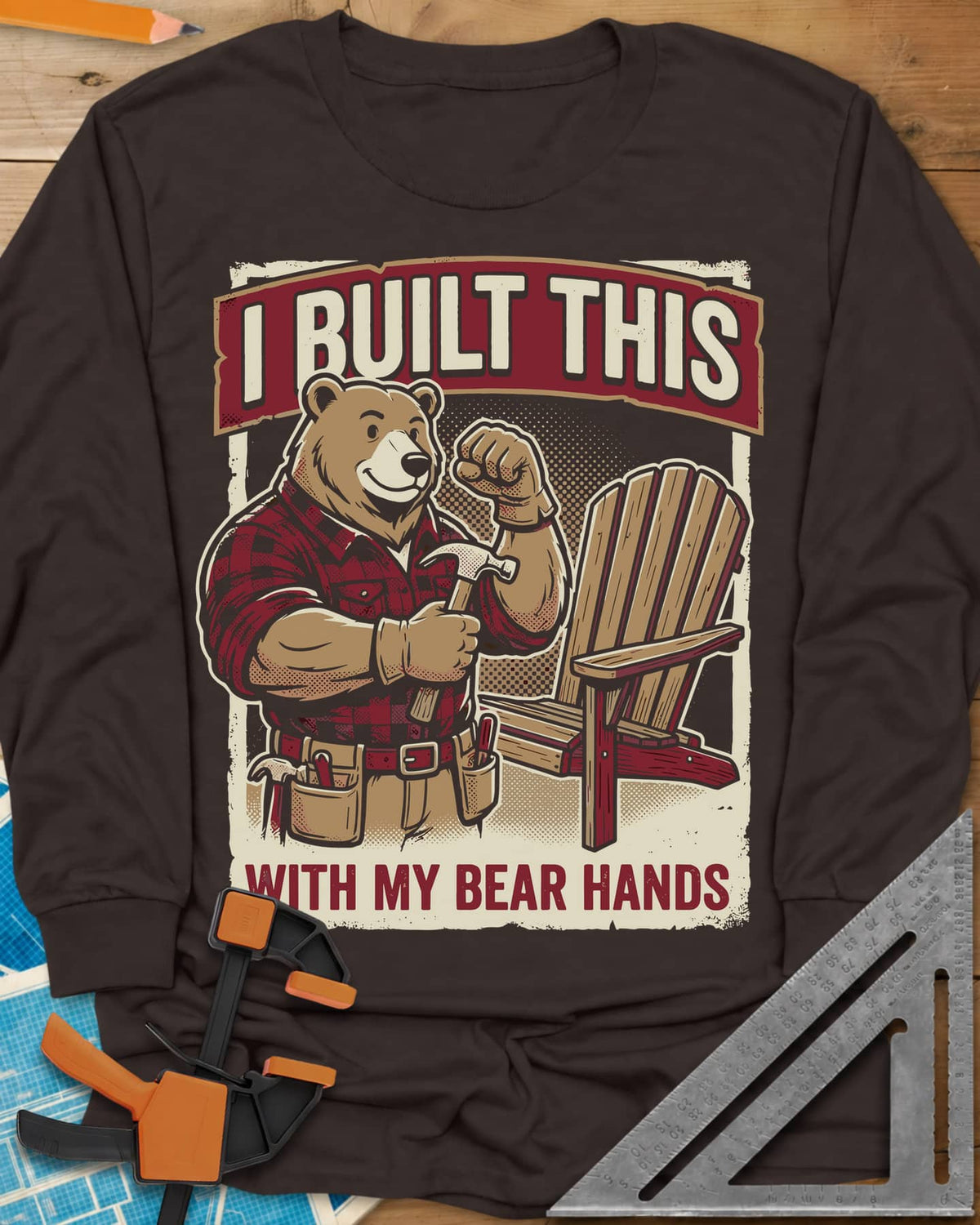 Bear Hands long sleeve shirt in Dark Chocolate, a flannel bear with hammer and tool belt beside an Adirondack chair