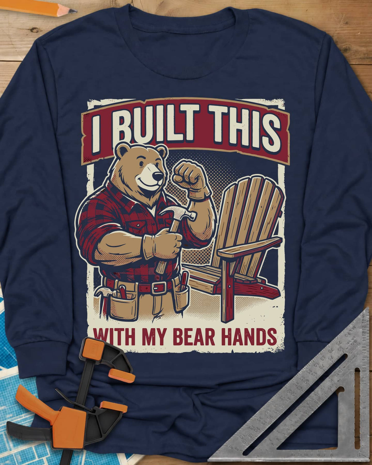 Bear Hands long sleeve shirt in Navy, a flannel bear with hammer and tool belt beside an Adirondack chair