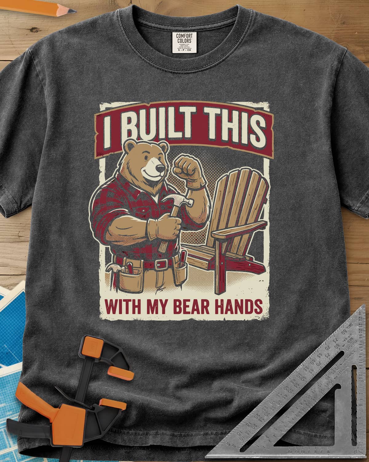 Bear Hands heavyweight tee in Pepper, a flannel bear with hammer and tool belt beside an Adirondack chair