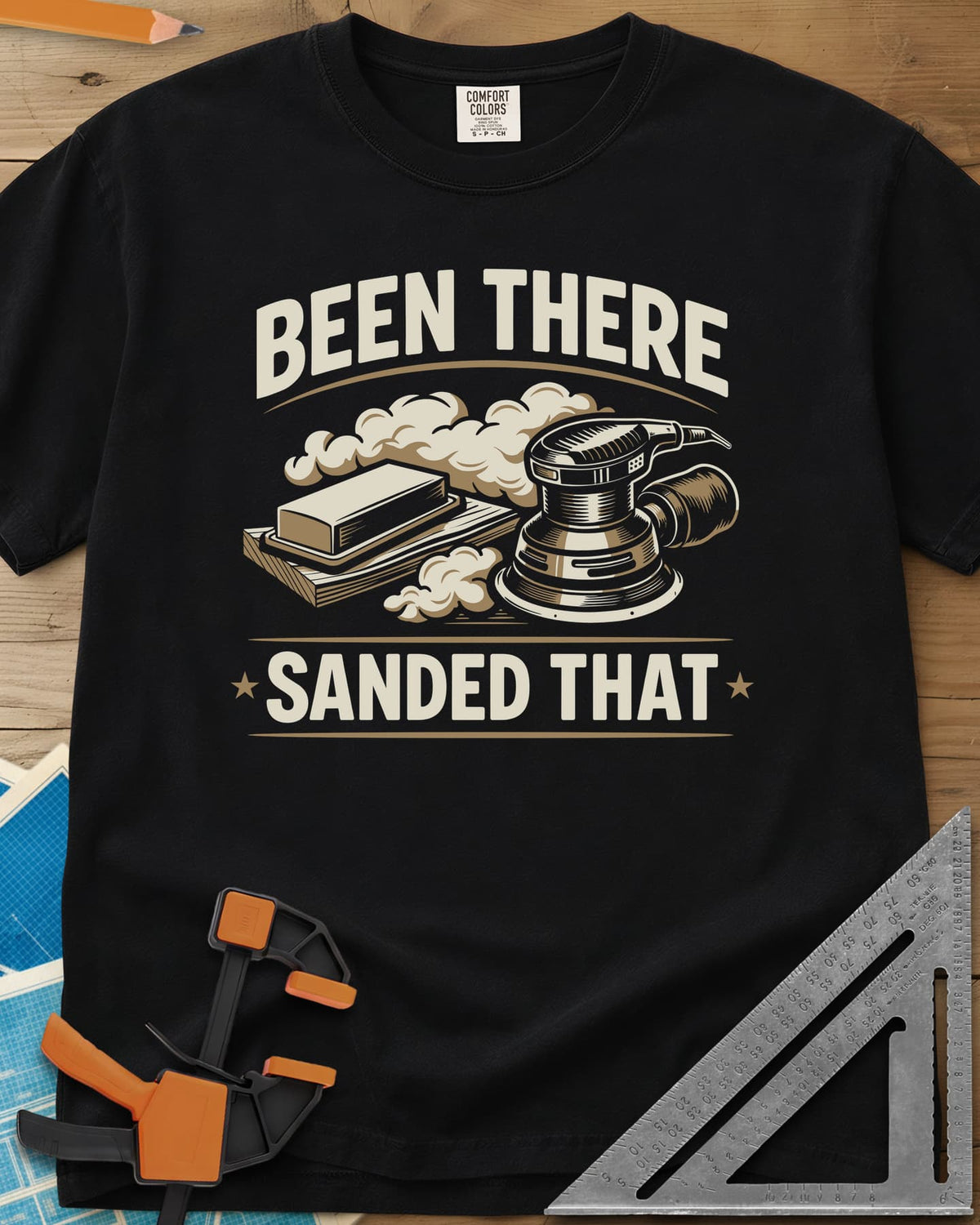 Been There Sanded That heavyweight tee in Black, a random orbital sander and sanding block in clouds of dust