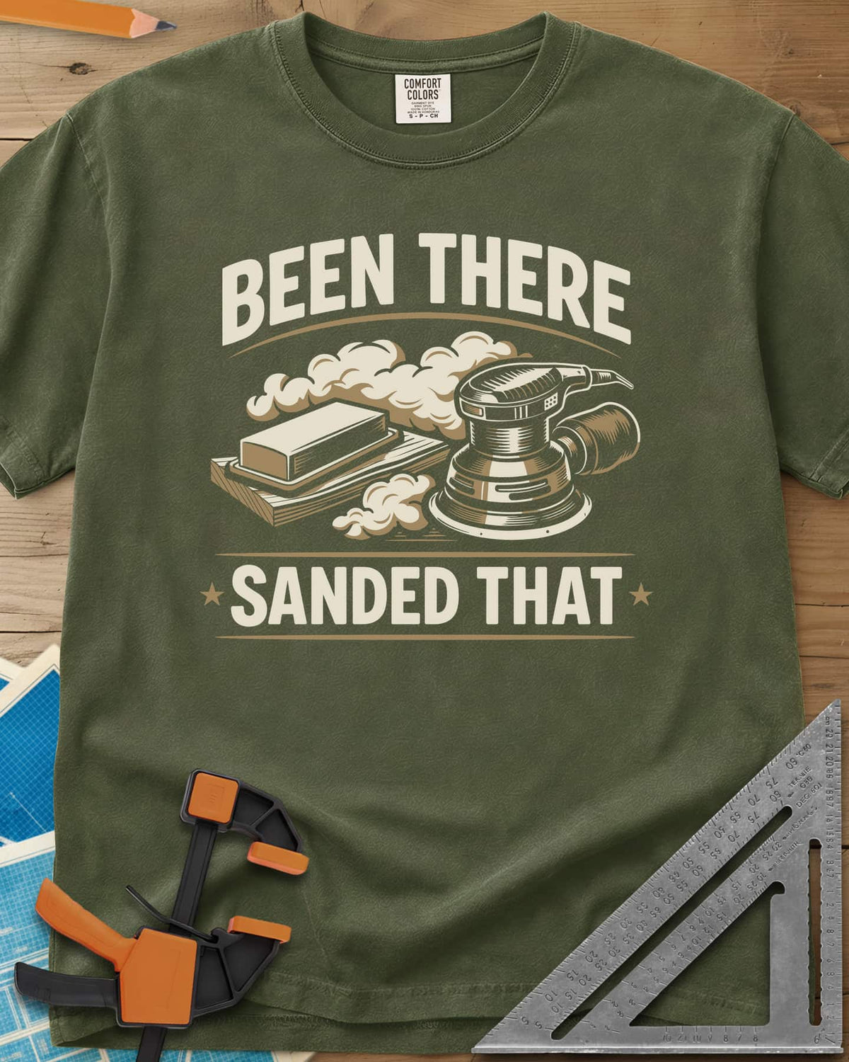 Been There Sanded That heavyweight tee in Hemp, a random orbital sander and sanding block in clouds of dust