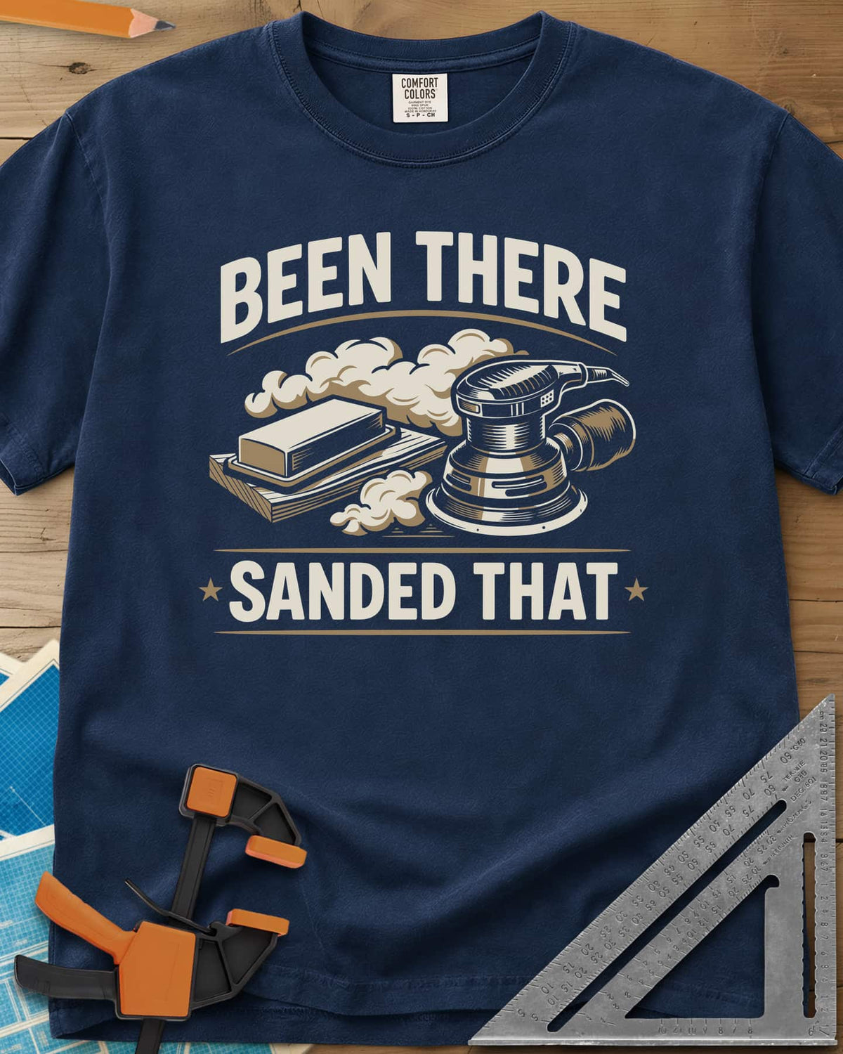 Been There Sanded That heavyweight tee in Navy, a random orbital sander and sanding block in clouds of dust
