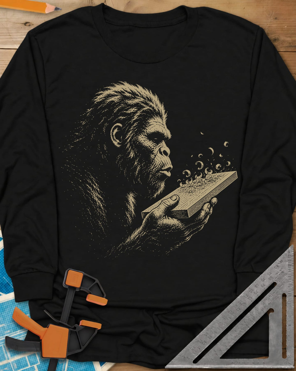 Bigfoot Blowing Sawdust long sleeve shirt in Black, Bigfoot in fine line work blowing sawdust curls off a board