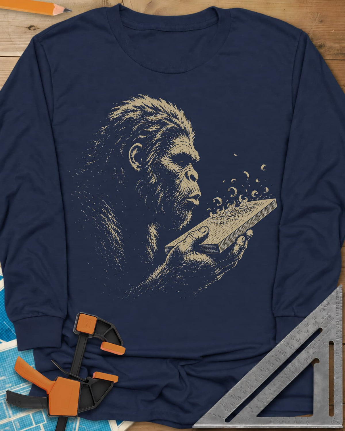 Bigfoot Blowing Sawdust long sleeve shirt in Navy, Bigfoot in fine line work blowing sawdust curls off a board