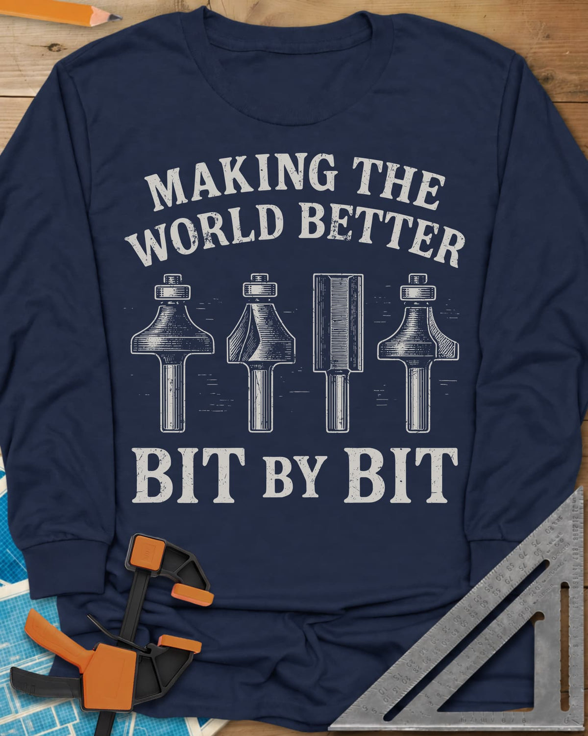 Bit by Bit long sleeve shirt in Navy, four engraved-style router bits between two lines of lettering
