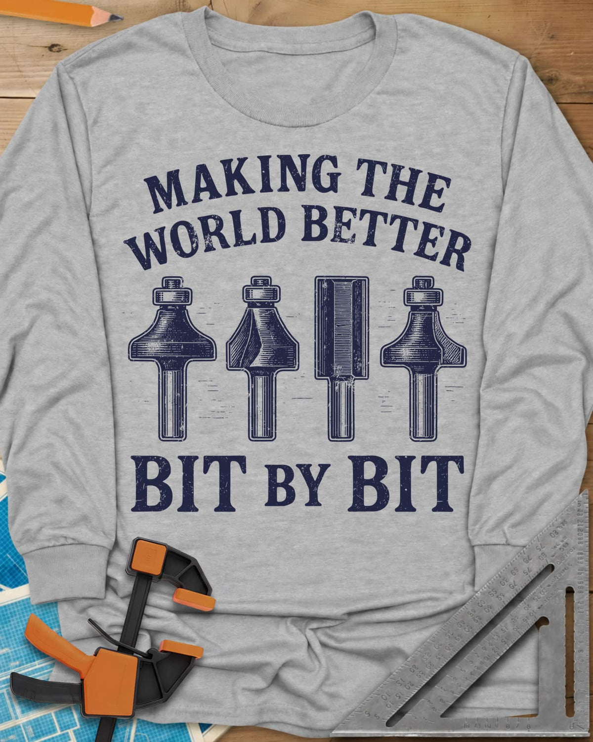 Bit by Bit long sleeve shirt in Sport Grey, four engraved-style router bits between two lines of lettering