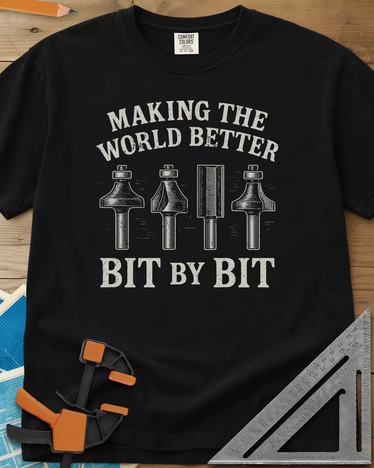 Bit by Bit heavyweight tee in Black, four engraved-style router bits between two lines of lettering