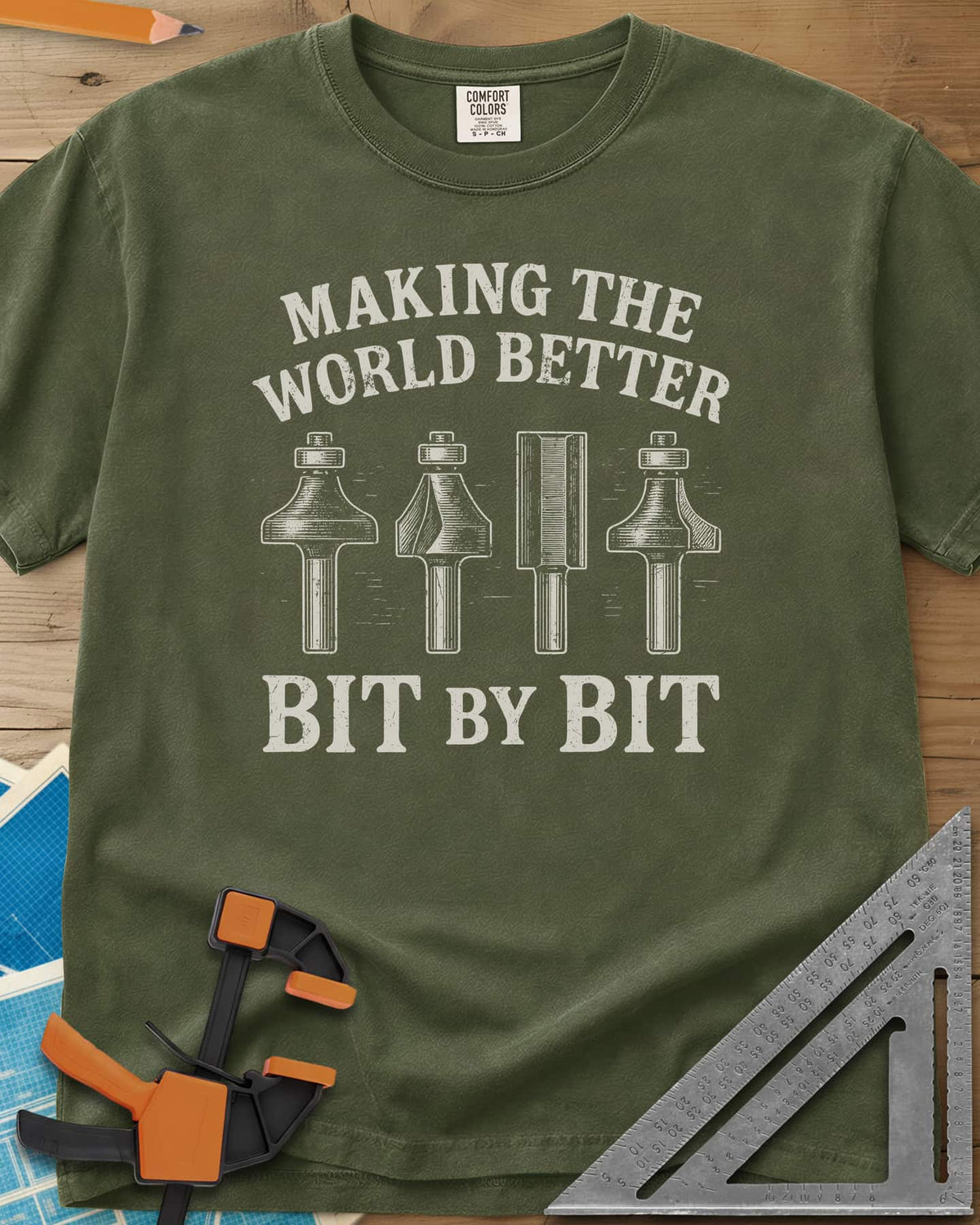 Bit by Bit heavyweight tee in Hemp, four engraved-style router bits between two lines of lettering